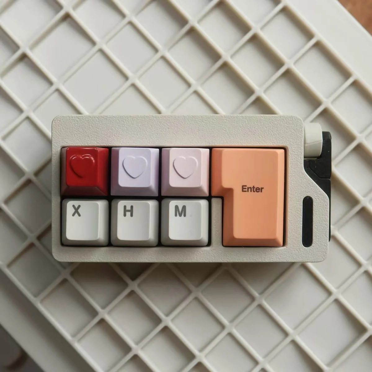 Close-up of Heart Keycap showing CNC machined detail