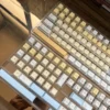 Close-up of dye-sublimated lamb and pastry designs on PBT keycaps