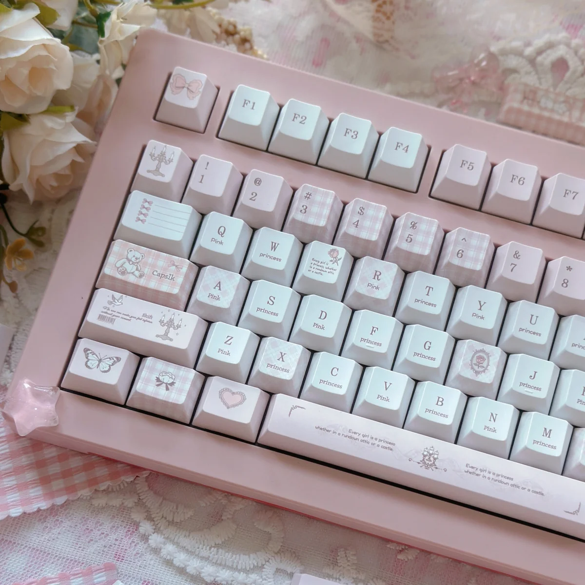Angled view of Love Alarm Cherry profile keycaps, emphasizing the ergonomic sculpted design.