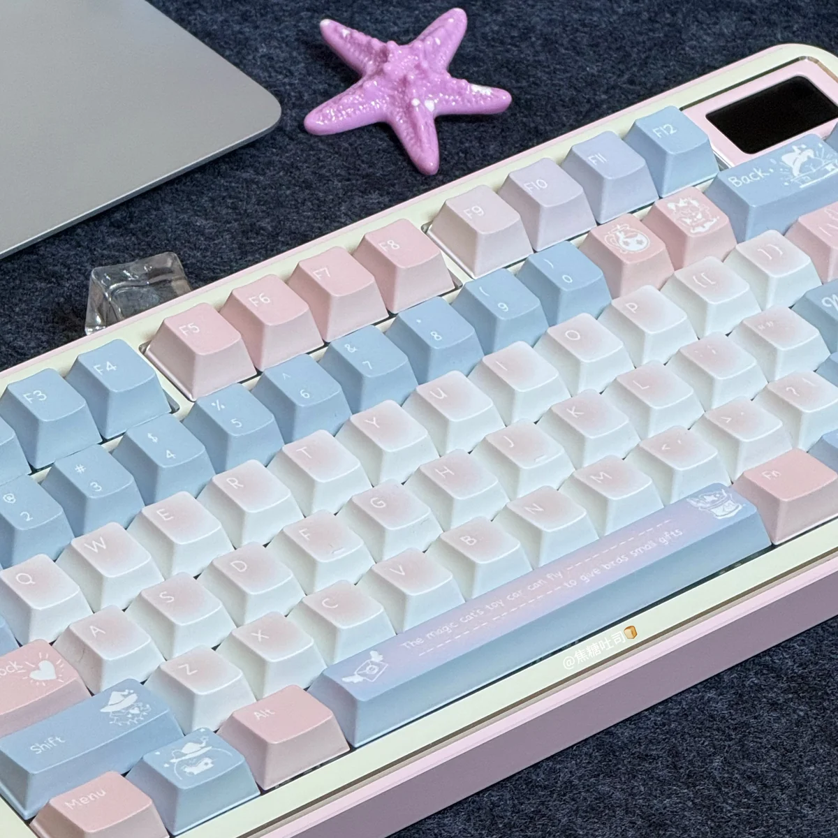 Close-up of pastel pink and blue dye-sublimated keycaps