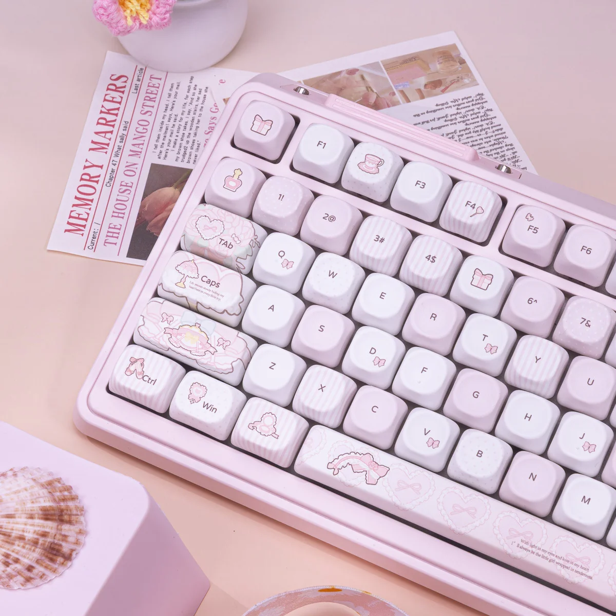 Close-up of pastel pink PBT keycaps with dye-sublimated legends, highlighting the smooth texture and color accuracy.