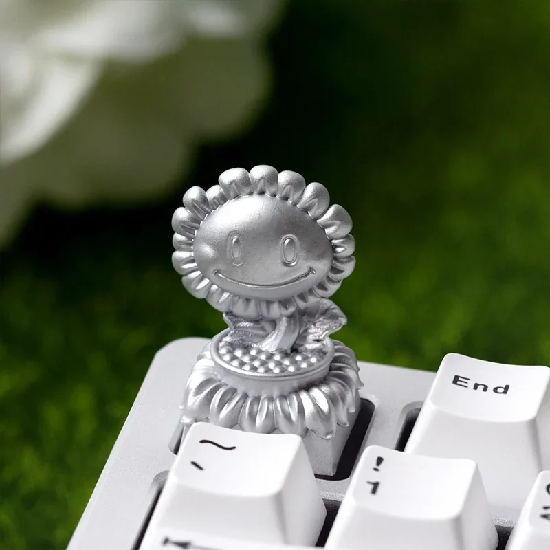 Collection of Plants vs. Zombies themed keycaps including the Sunflower trophy