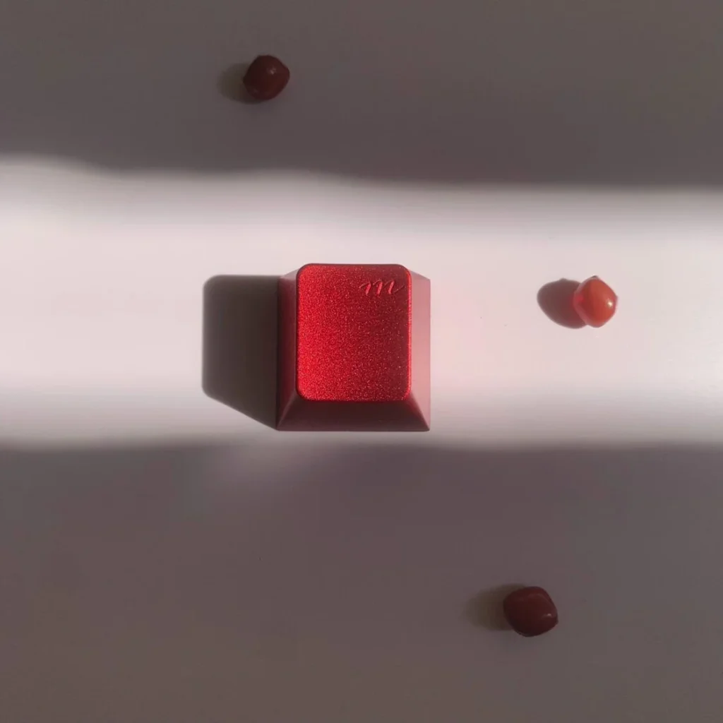 Red Aluminum Artisan Keycap on a mechanical keyboard