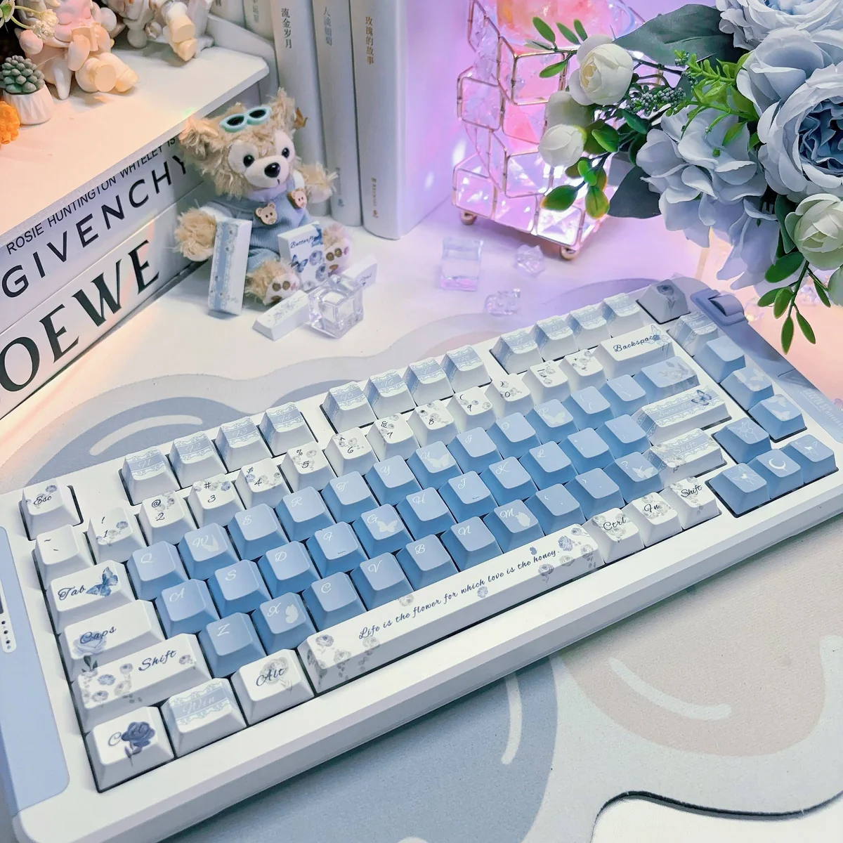 Close-up of delicate rose and butterfly designs on PBT keycaps
