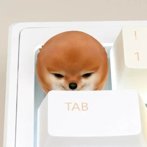 Handcrafted Shiba Inu artisan keycap on a keyboard, showcasing its playful design and resin craftsmanship.