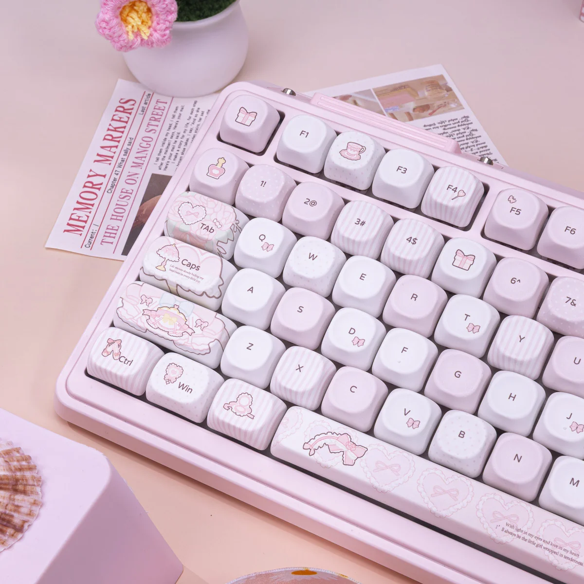 A whimsical keyboard setup featuring the Sweet Milk Candy keycaps, a matching desk mat, and other pastel accessories.