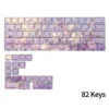 Close-up of side-engraved legends on a subtle violet PBT keycap