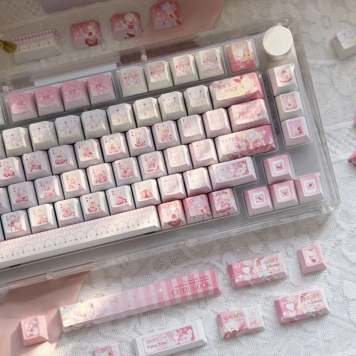 Close-up of Aikatsu! anime character keycaps, vibrant colors