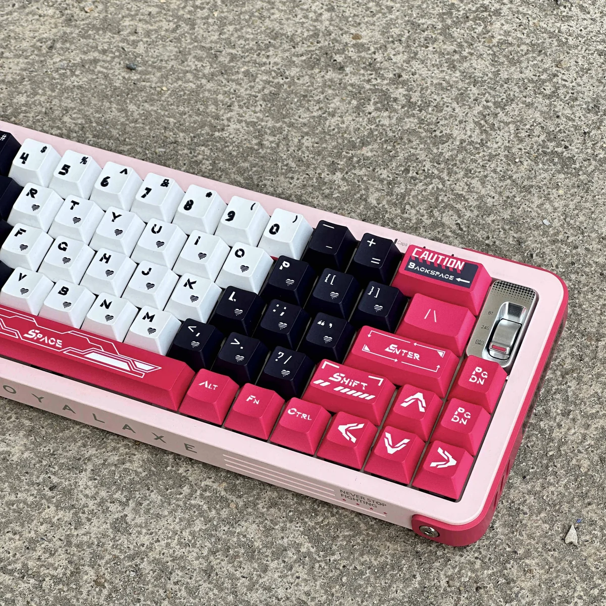 Side profile view of Arcee Cherry profile keycaps, showing ergonomic curvature and height