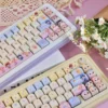 Detail of Baby Zoraa spacebar and novelty keycaps with bubblegum theme