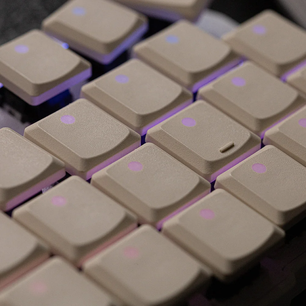 Beige translucent PBT keycap set on a mechanical keyboard, close-up