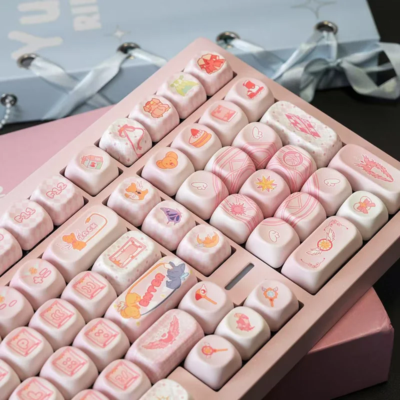 Cardcaptor Sakura keycap set installed on a white mechanical keyboard, showing the overall aesthetic.