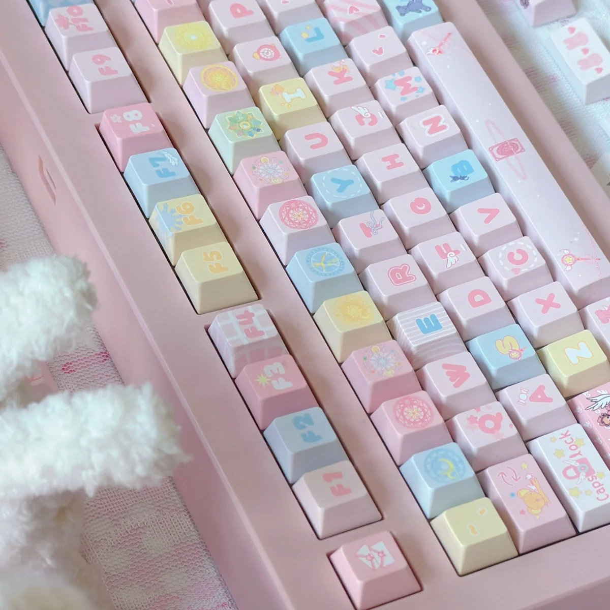 Close-up of Cardcaptor Sakura themed keycaps, highlighting the crisp, dye-sublimated legends and pastel colors.