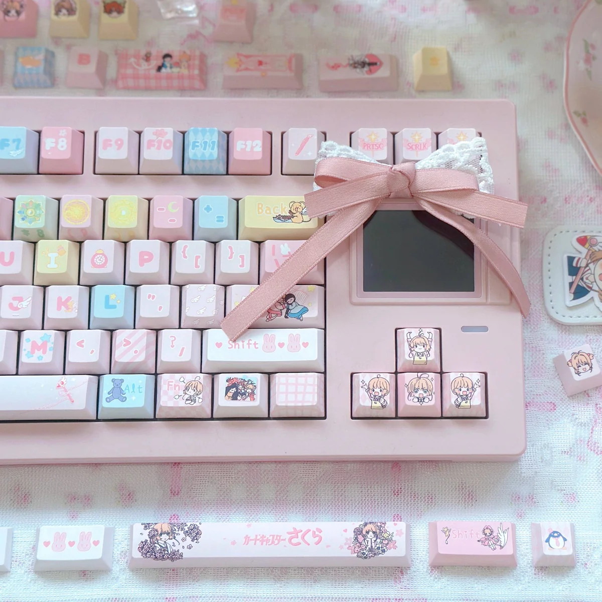 Detailed shot of various Cardcaptor Sakura character keycaps, emphasizing the unique design and artistry.