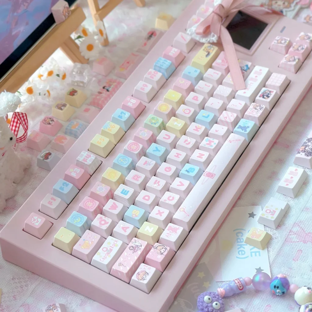Cardcaptor Sakura PBT Keycap Set on a white mechanical keyboard, showcasing vibrant anime characters and magical symbols.