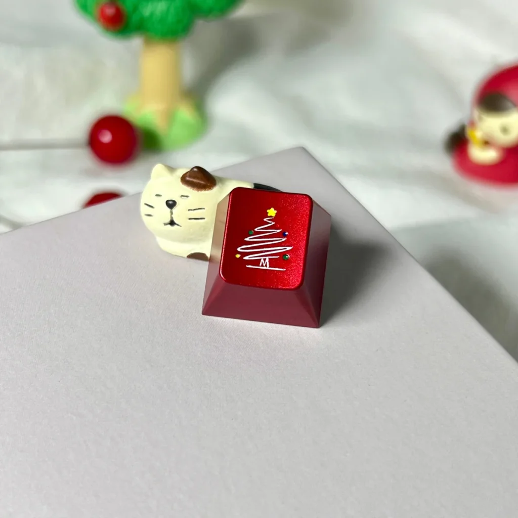 Side view of the Cherry R4 profile of the Christmas Tree Snowflake metal keycap