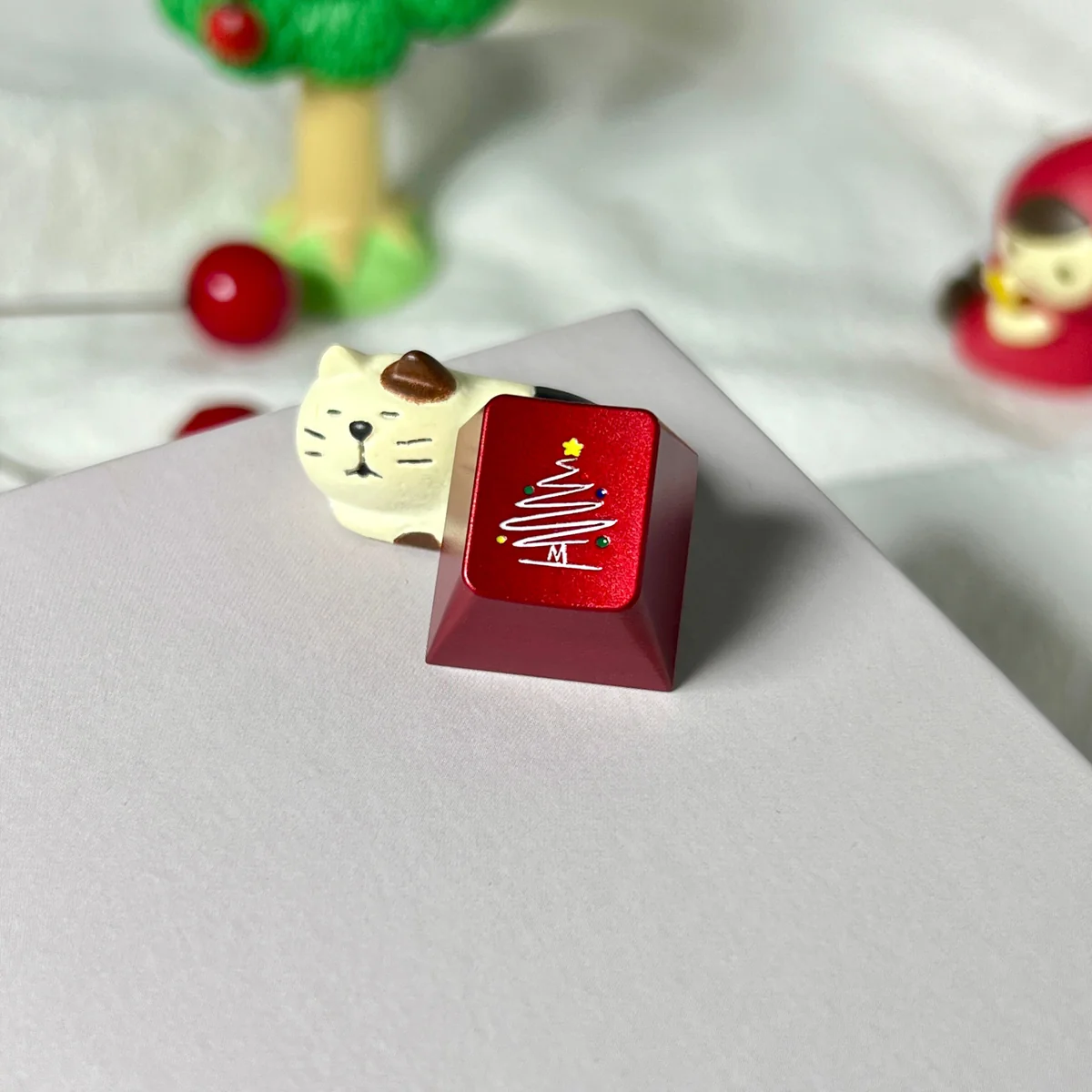 Side view of the Cherry R4 profile of the Christmas Tree Snowflake metal keycap