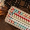 Close-up of PBT dye-sub keycaps with snowy Christmas tree design
