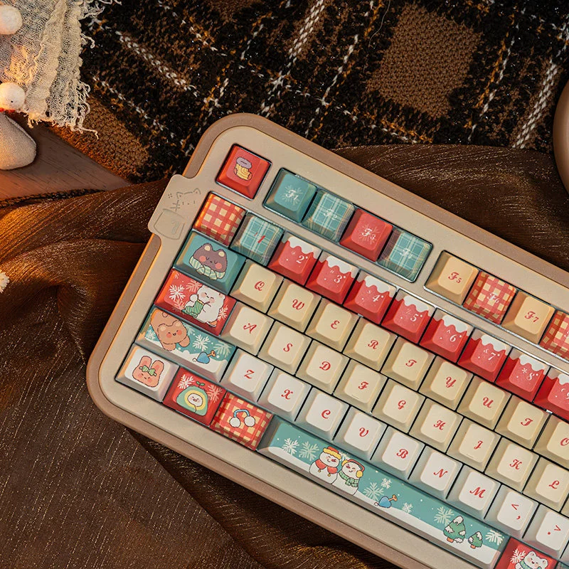 Close-up of PBT dye-sub keycaps with snowy Christmas tree design