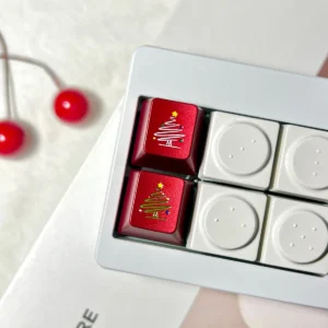 Christmas Tree Snowflake CNC Aluminum Keycap on a mechanical keyboard with festive lighting