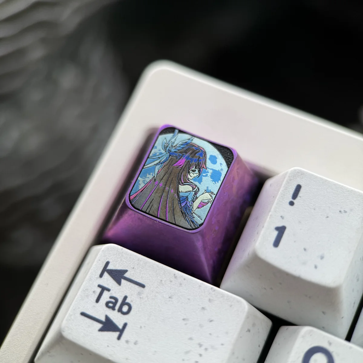 Detailed view of Columbina's intricate design on a titanium keycap