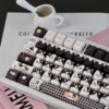 Detail shot of a Cow Cat keycap, showing dye-sublimated legends and smooth finish