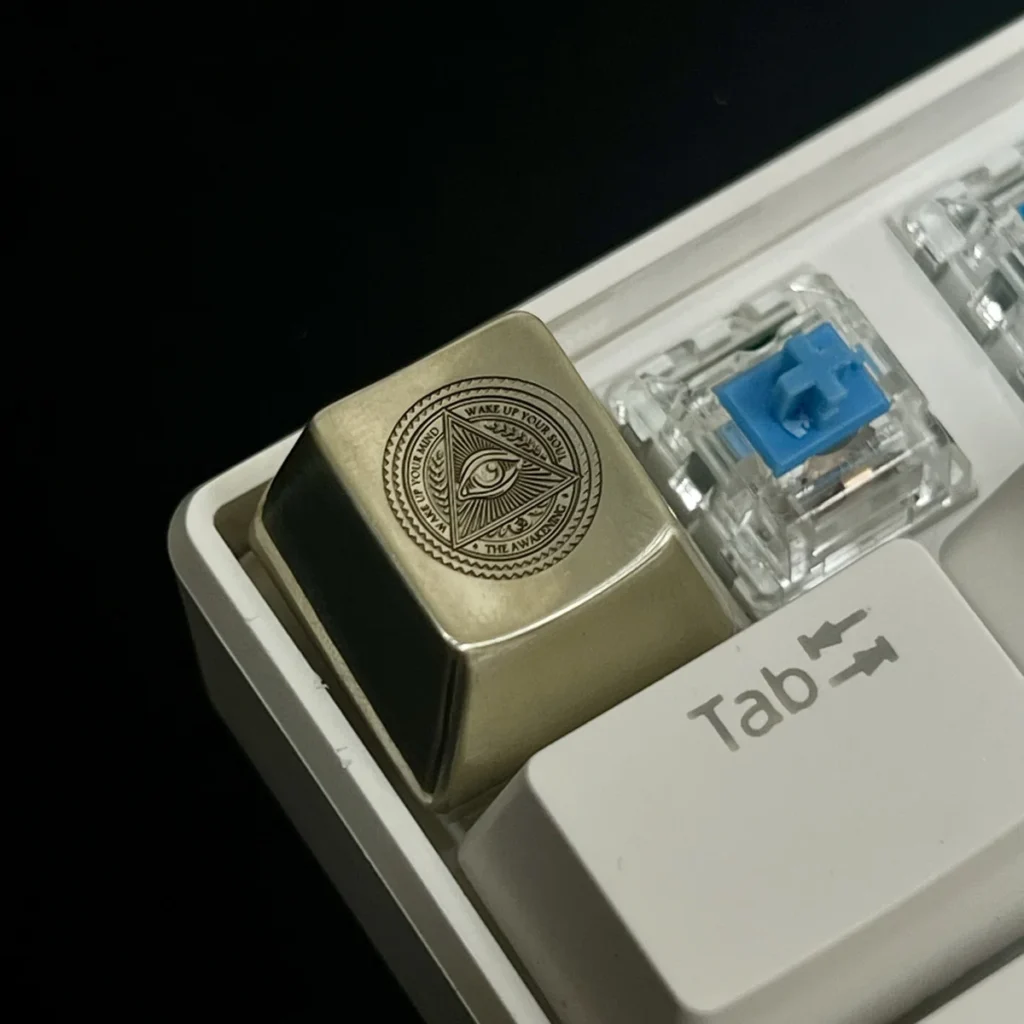 Eye of Horus Keycap in white copper and brass material options