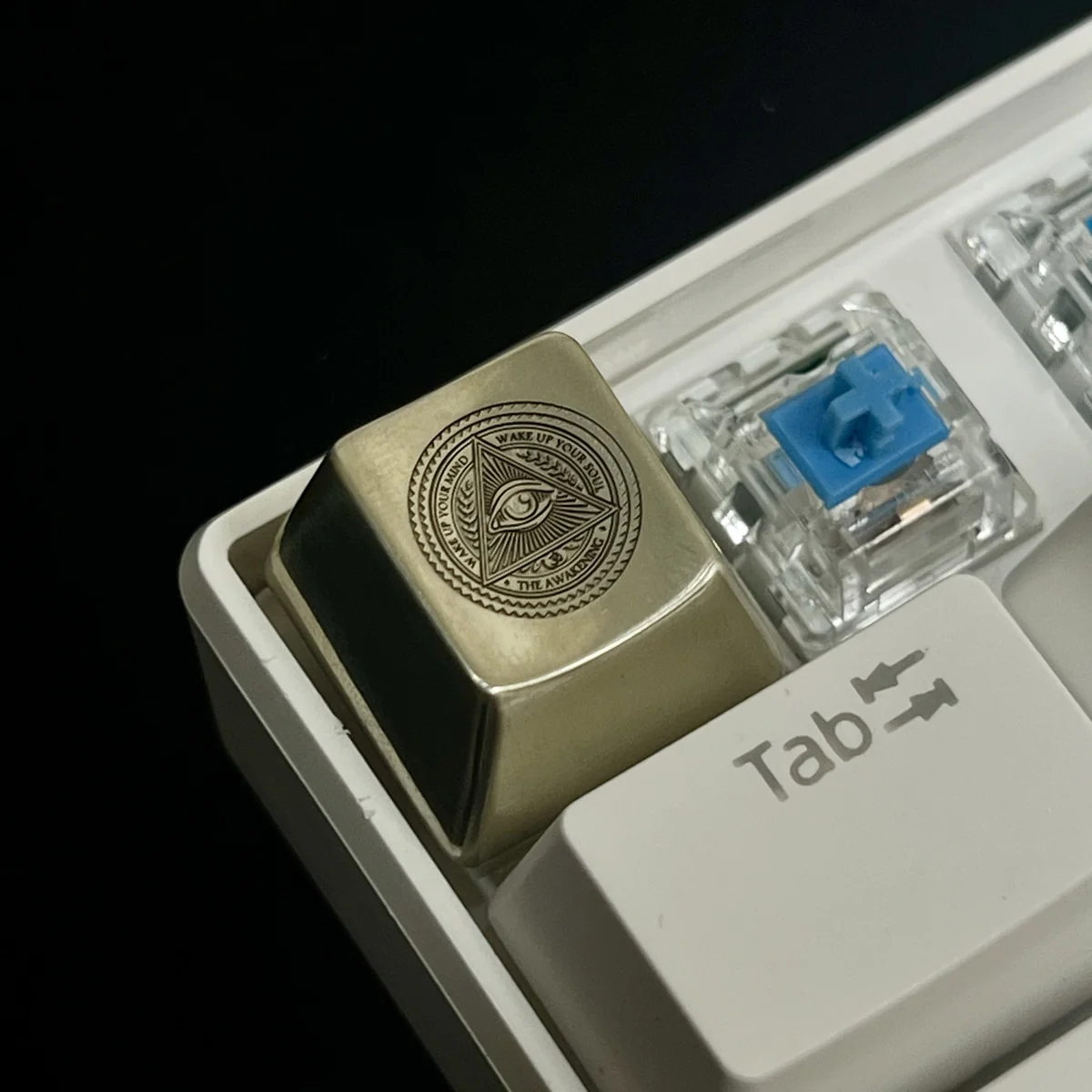 Eye of Horus Keycap in white copper and brass material options
