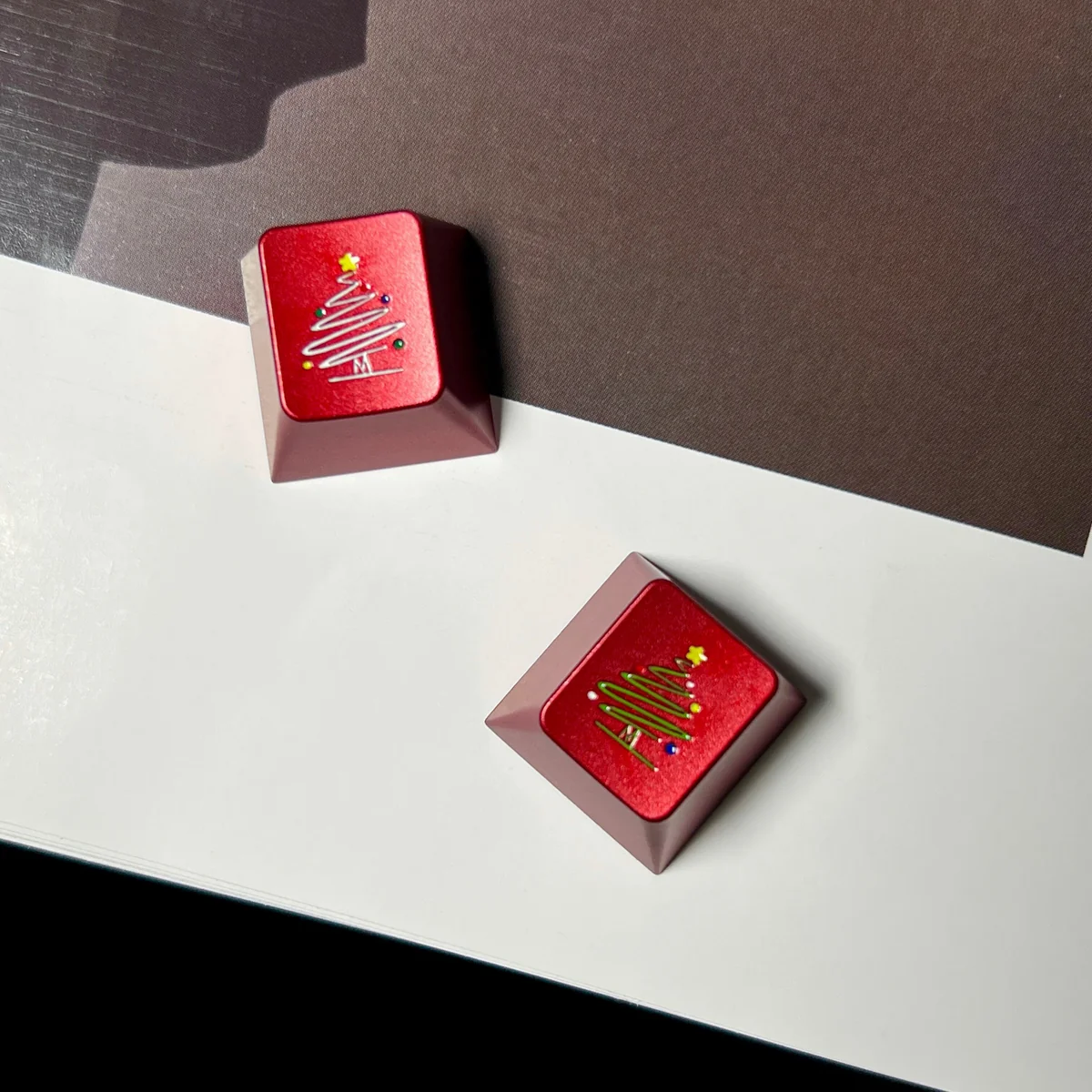 Close-up of the intricate metallic Christmas tree and snowflake design on the keycap