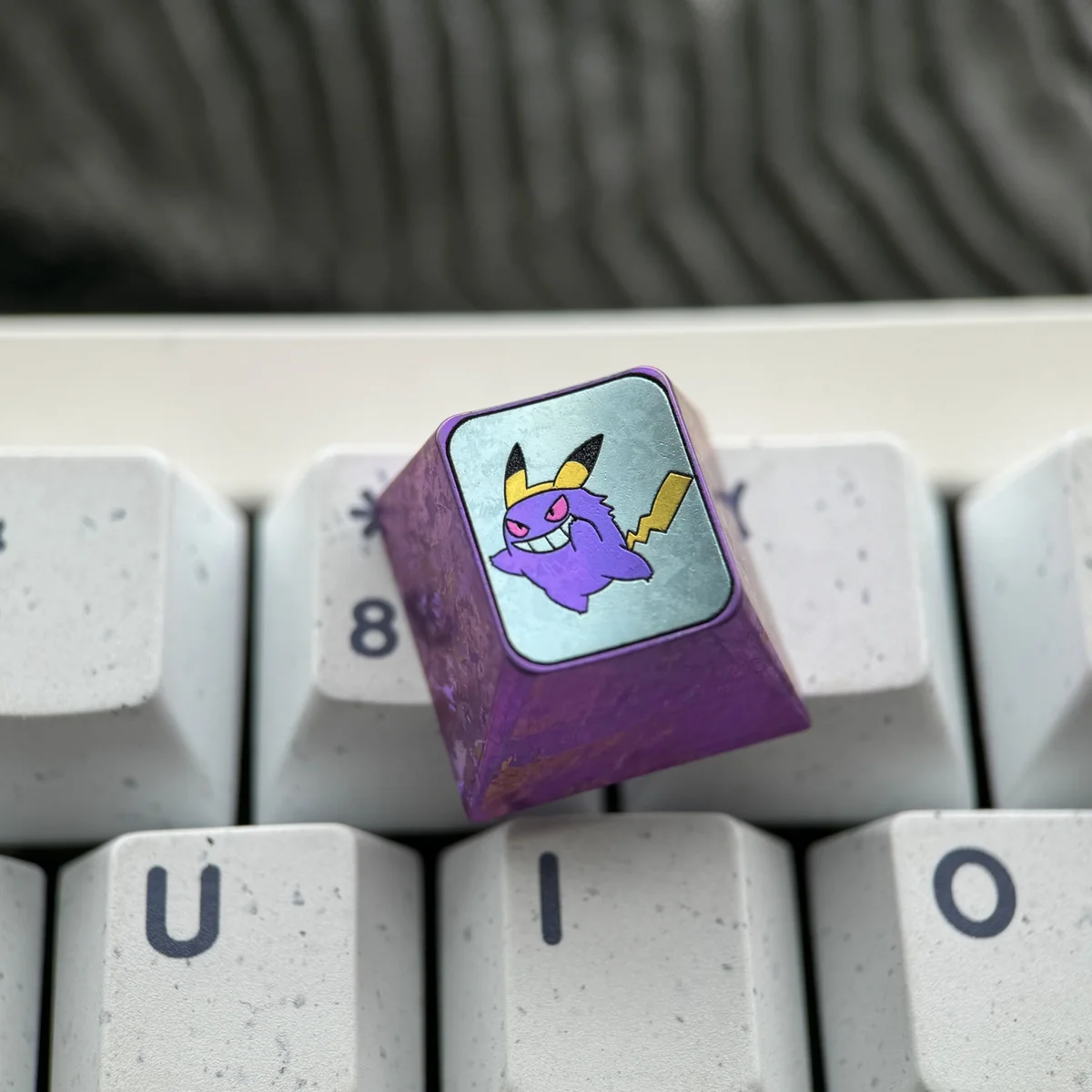 Gengar artisan keycap from a side angle, demonstrating its Cherry profile and seamless fit on an MX switch.
