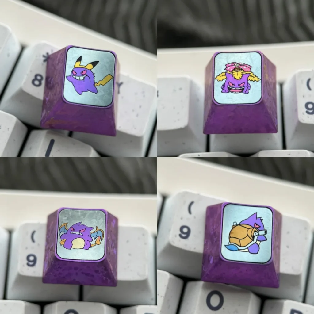 Gengar Titanium Artisan Keycap on keyboard, showing intricate Gengar face detail and metallic sheen.