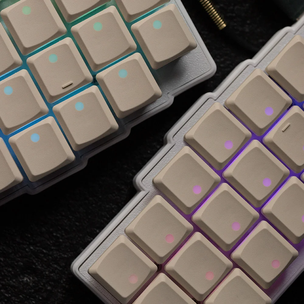 Grey low-profile Choc V1 keycaps with vibrant backlighting effect