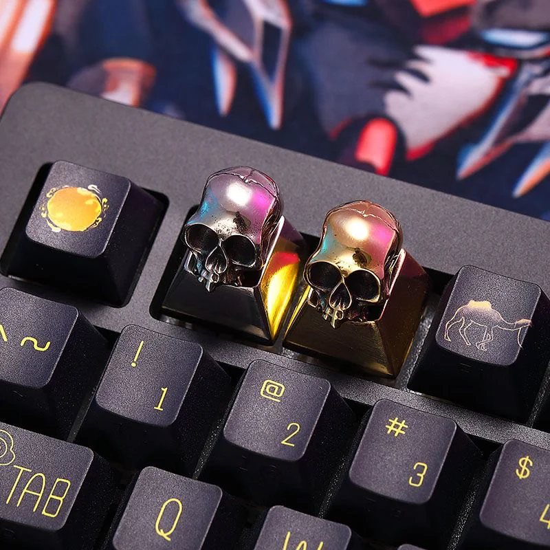 Close-up of a handcrafted brass skull keycap on a mechanical keyboard, showcasing intricate details.