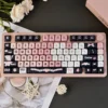 Maid Cat PBT Keycap Set in black and pink on a mechanical keyboard