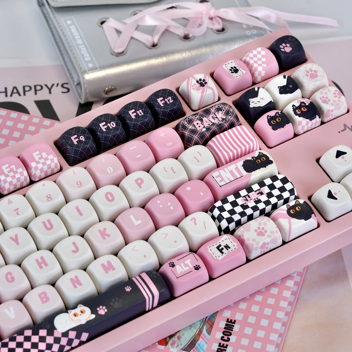 Close-up of Naughty Cat keycaps showing dye-sublimated legends and smooth texture