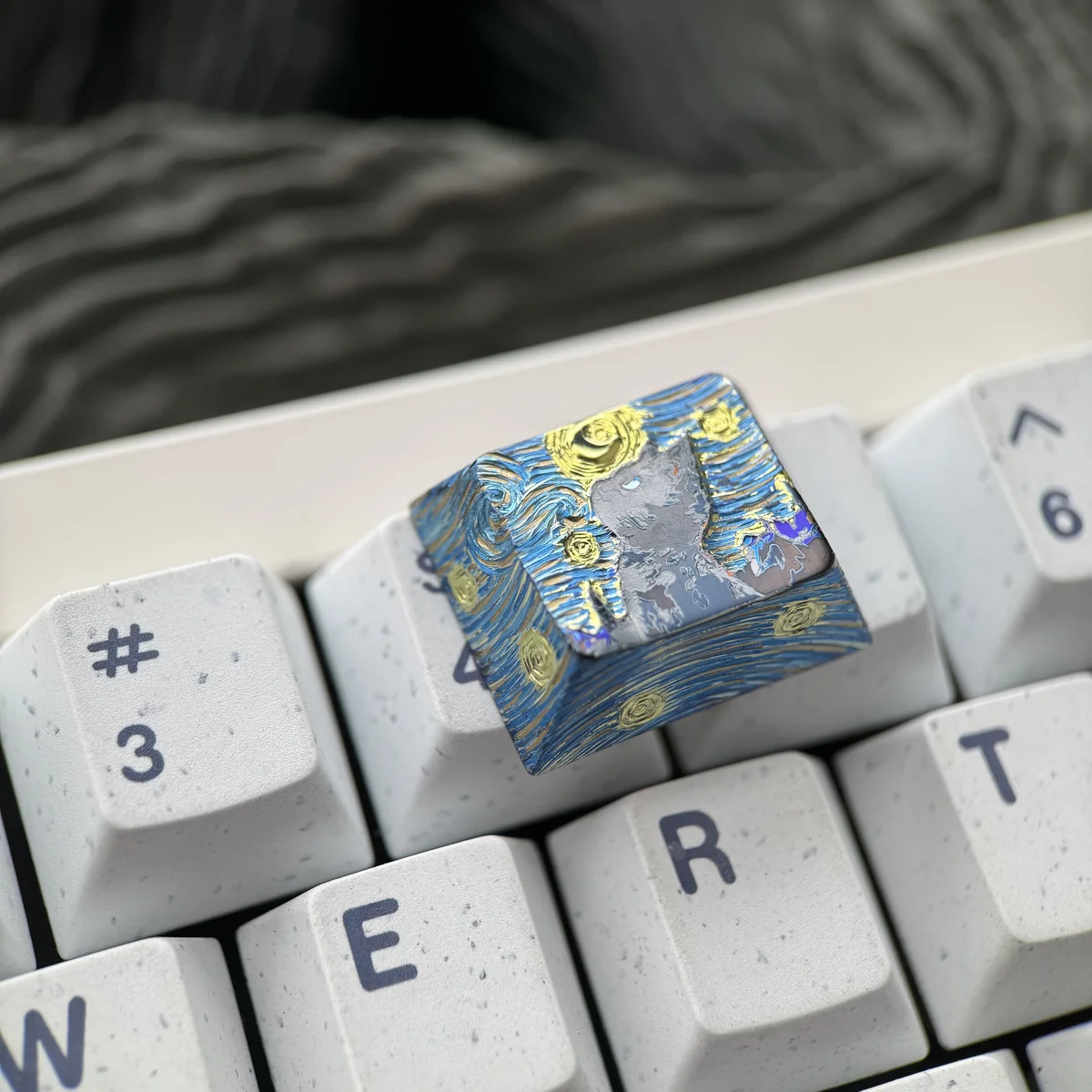Collection of Mystical Cat Titanium keycaps in various 1.25U sizes