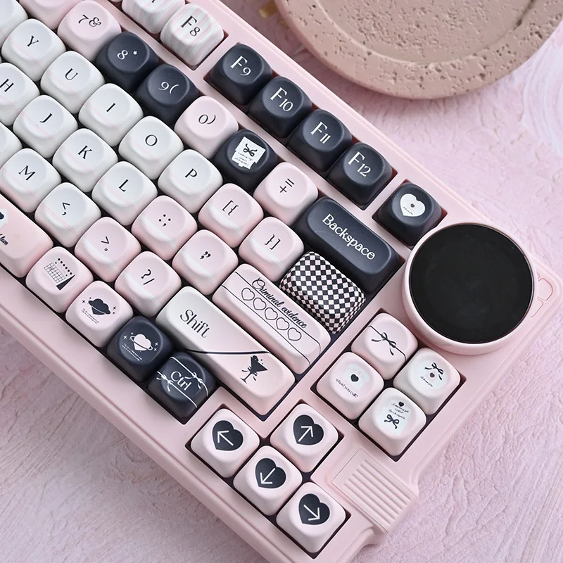 Full view of 118 Original Sin keycaps laid out, highlighting the dark and cute duality.