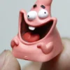 Collection of Patrick Star Giggle Keycaps in different lighting