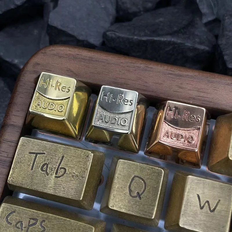 Resonant Audio Keycap in Polished Copper, top view on a dark background