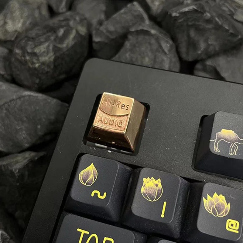 Reflective surface of a polished Copper keycap, showing its mirror-like finish