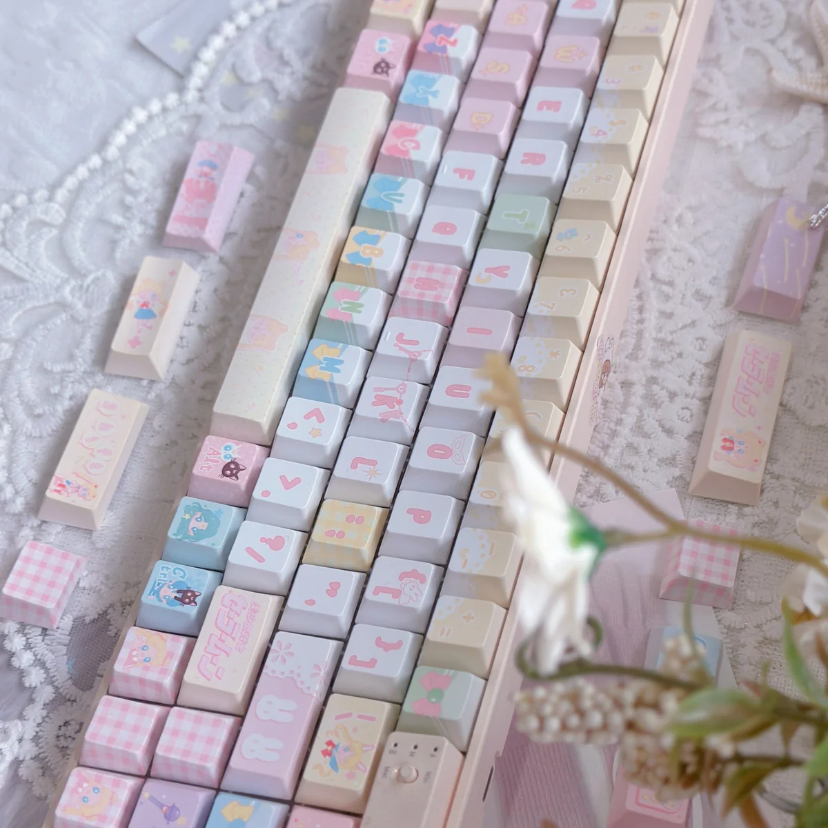 Keyboard setup featuring the Sailor Moon keycap set, illuminated by soft RGB lighting, creating a magical ambiance.