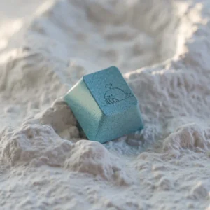 Close-up of Sea Salt Whale aluminum keycap on a mechanical keyboard