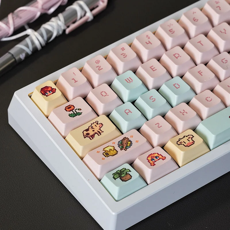 Close-up of Stardew Valley keycaps mounted on a mechanical keyboard, highlighting vibrant pixel art