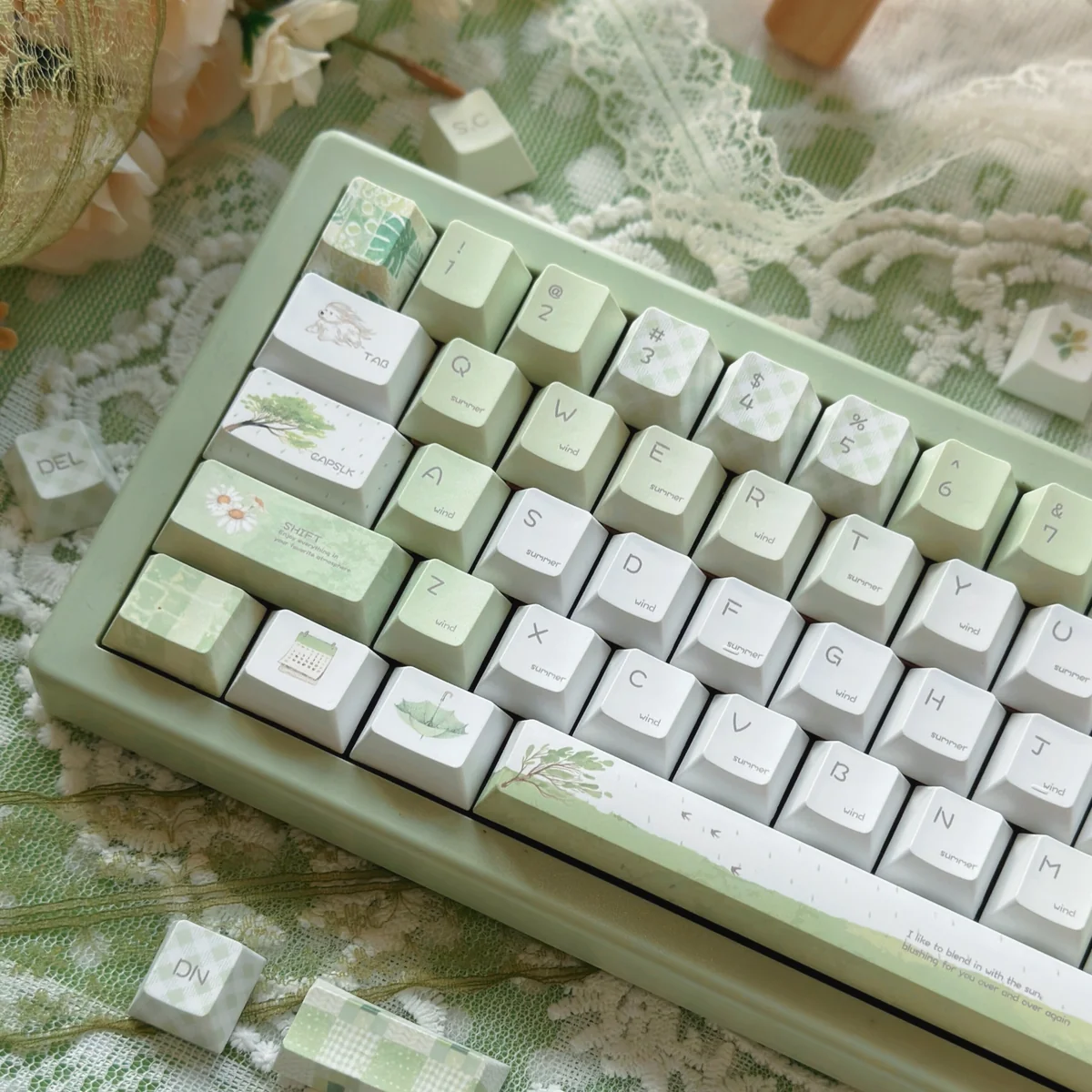 Close-up of Summer Rain keycaps, highlighting the soft, fluid dye-sublimated patterns.