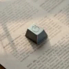 Top view of the metallic sleeping cat keycap for MX switches