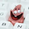 Vibrant pink Patrick Star keycap showing detailed resin craftsmanship