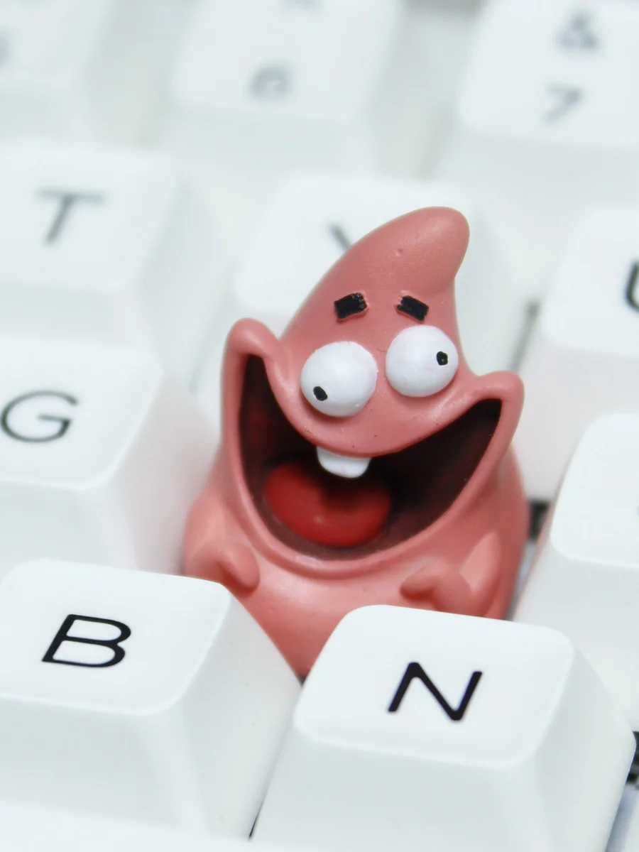 Vibrant pink Patrick Star keycap showing detailed resin craftsmanship