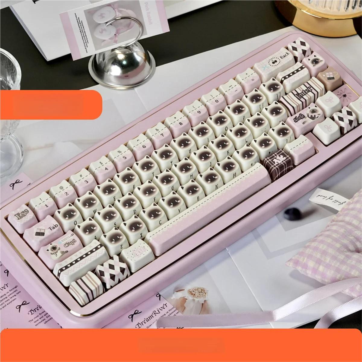 Macro shot of multiple Pink Siamese Cat keycaps, emphasizing the vibrant pink and white color scheme.