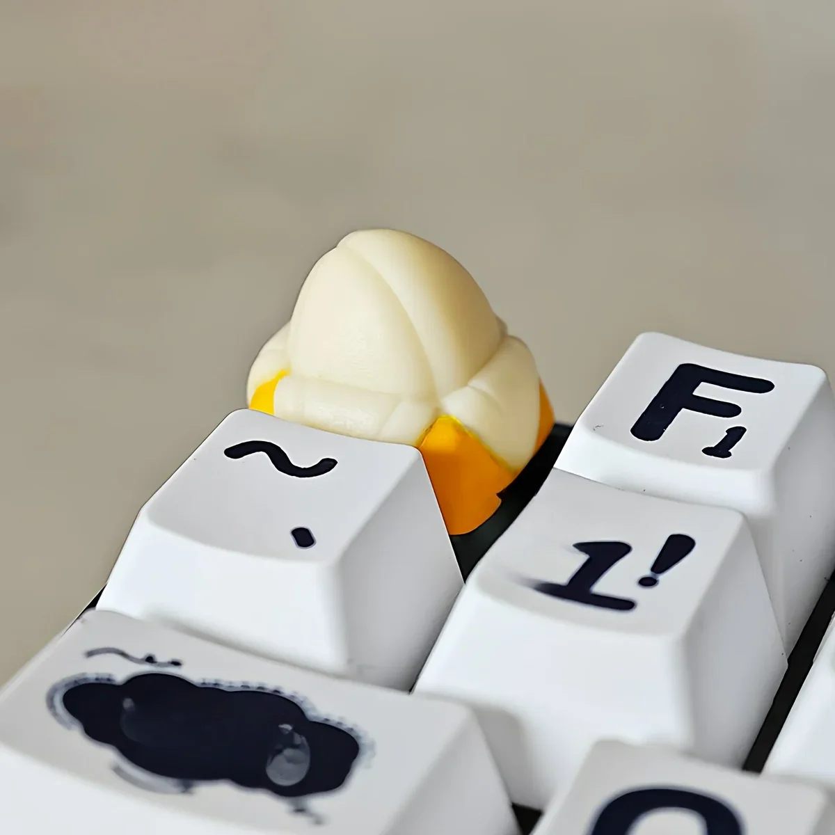 Close-up of the vibrant yellow Whimsical Banana Keycap detailing texture