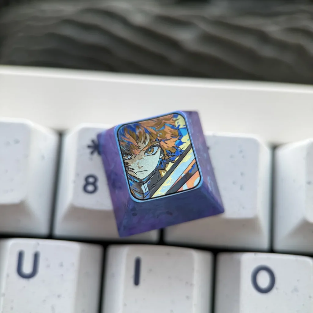 Close-up of Zenitsu Agatsuma Titanium Keycap for mechanical keyboards, showcasing intricate anodized art and vibrant colors.